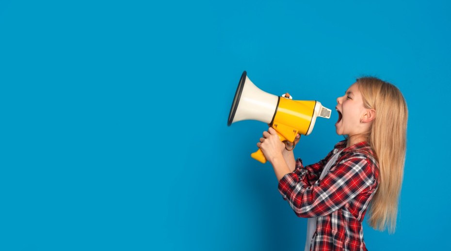 A girl shouting through a megaphone